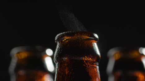 Close-Up-Of-Condensation-Droplets-On-Neck-Of-Bottles-Of-Cold-Beer-Or-Soft-Drinks-With-Water-Vapour-After-Opening-3